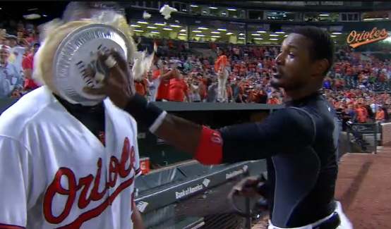 Henry Urrutia getting pie in face by team member after hitting first walk-off home run.