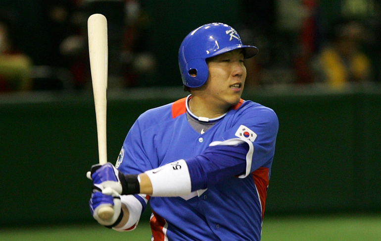 Hyun Soo Kim finishes a swing.