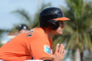 Ryan Flaherty stretches and watches.