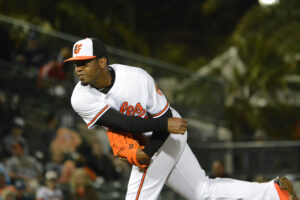 Mychal Givens follows through on his pitch.