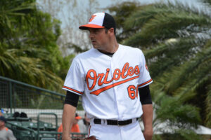 T.J. McFarland of the Orioles looks in for a sign.