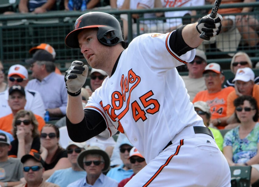 Mark Trumbo watches after swinging.