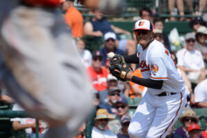 Manny Machado prepares to throw the runner out.