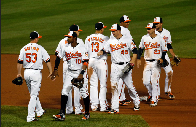 The Orioles shake hands after beating the Twins.
