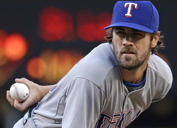 Cole Hamels of the Rangers sets to pitch.
