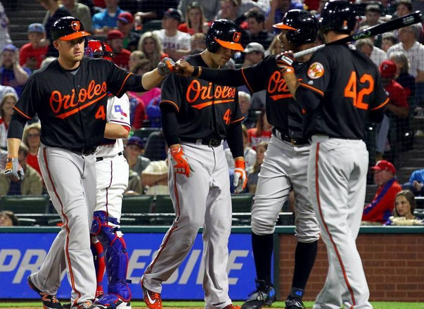 Orioles players celebrate after a home run.