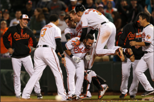 Pedro Alvarez mobbed by O's teammates.