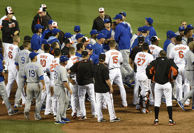 Orioles and Royals players gather in a bench-clearing brawl.