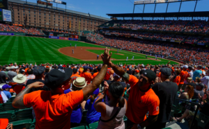 Orioles fans high five at Oriole Park at camden yards.