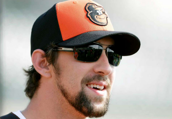 Michael Phelps in an Orioles hat and sunglasses.