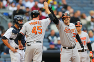 Mark Trumbo and Matt Wieters high five.