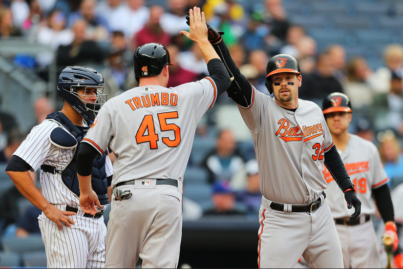 Mark Trumbo and Matt Wieters high five.