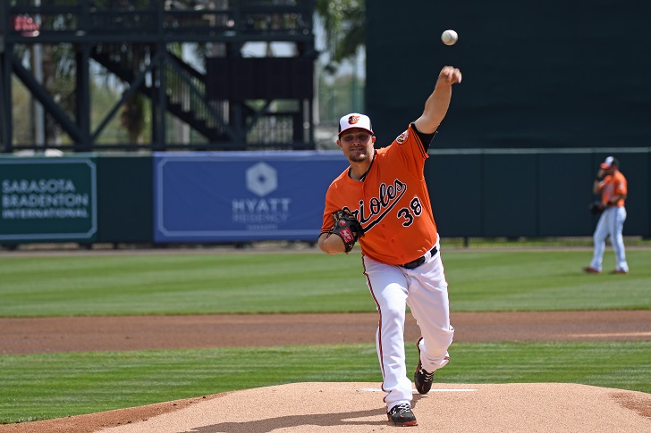 Wade Miley of the Orioles pitches from the mound.