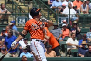 Chris Davis of the Orioles watches a ball fly after swinging.