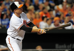 Mark Trumbo watches a baseball fly.