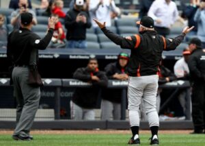 Buck Showalter is ejected by the home plate ump in New York.