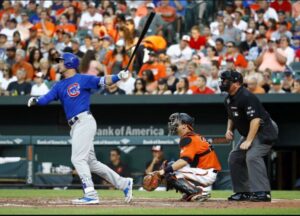 A Cubs player watches the ball sail at Oriole Park at Camden Yards.