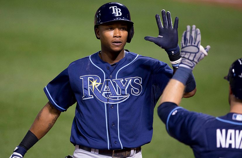 Tim Beckham of the Rays gives a high five.