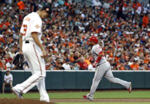 Kevin Gausman walks off the mound as an Angels player rounds the bases after a HR.