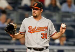 Wade Miley holds up the baseball.