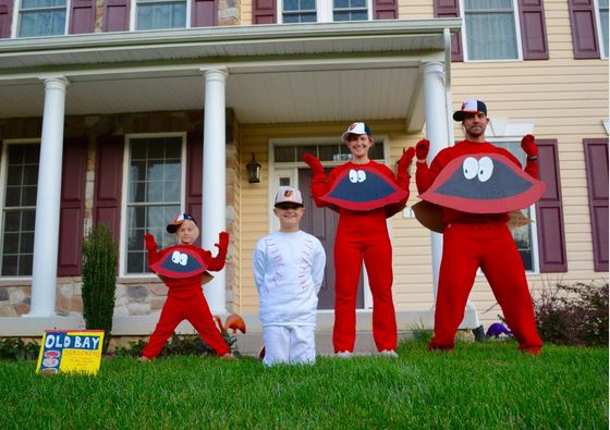 A family dressed as crabs and a baseball.