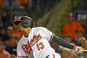 Manny Machado follows the ball after a swing.