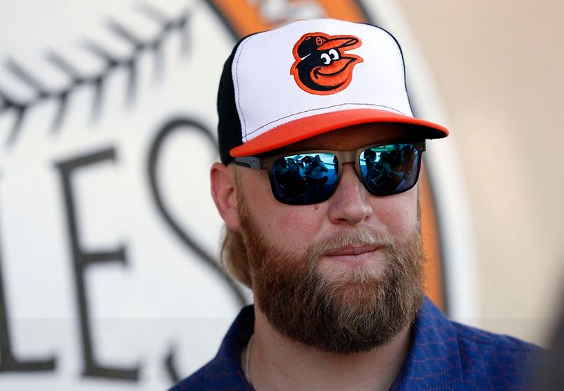 Andrew Cashner in an O's hat and Sunglasses.