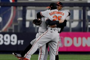 Anthony Santander and Adam Jones in a victory hug.