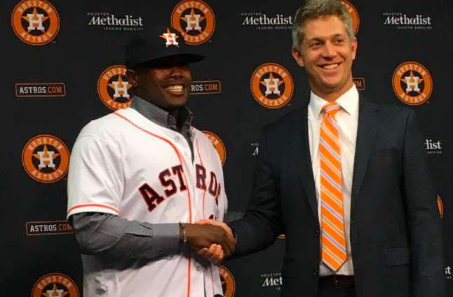 Mike Elias and and an Astros player.