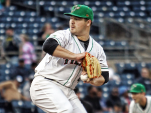 Keegan Akin pitches.